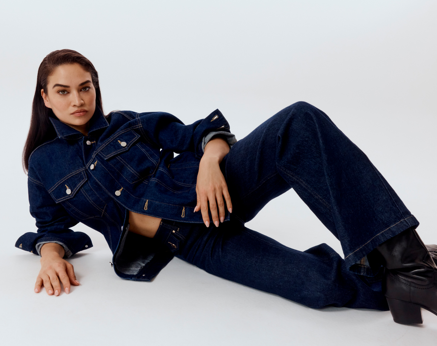 Shanina in indigo blue oversized denim jacket and raw indigo wide leg coin tab jean