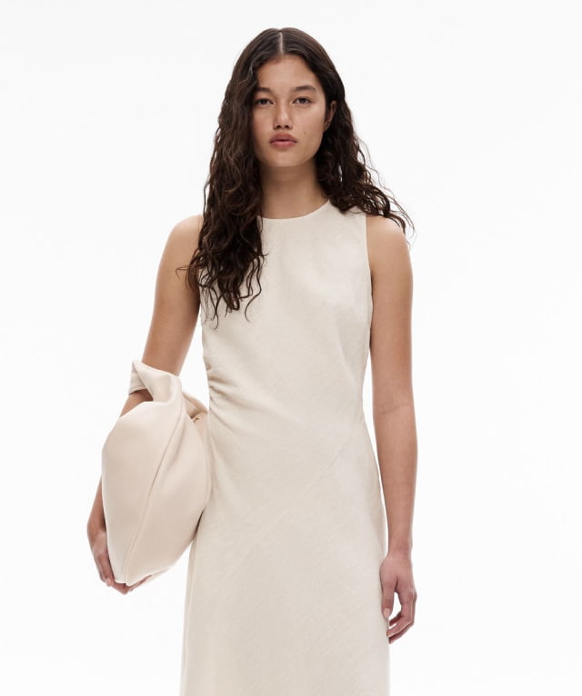 Woman in flax linen sleeveless midi dress