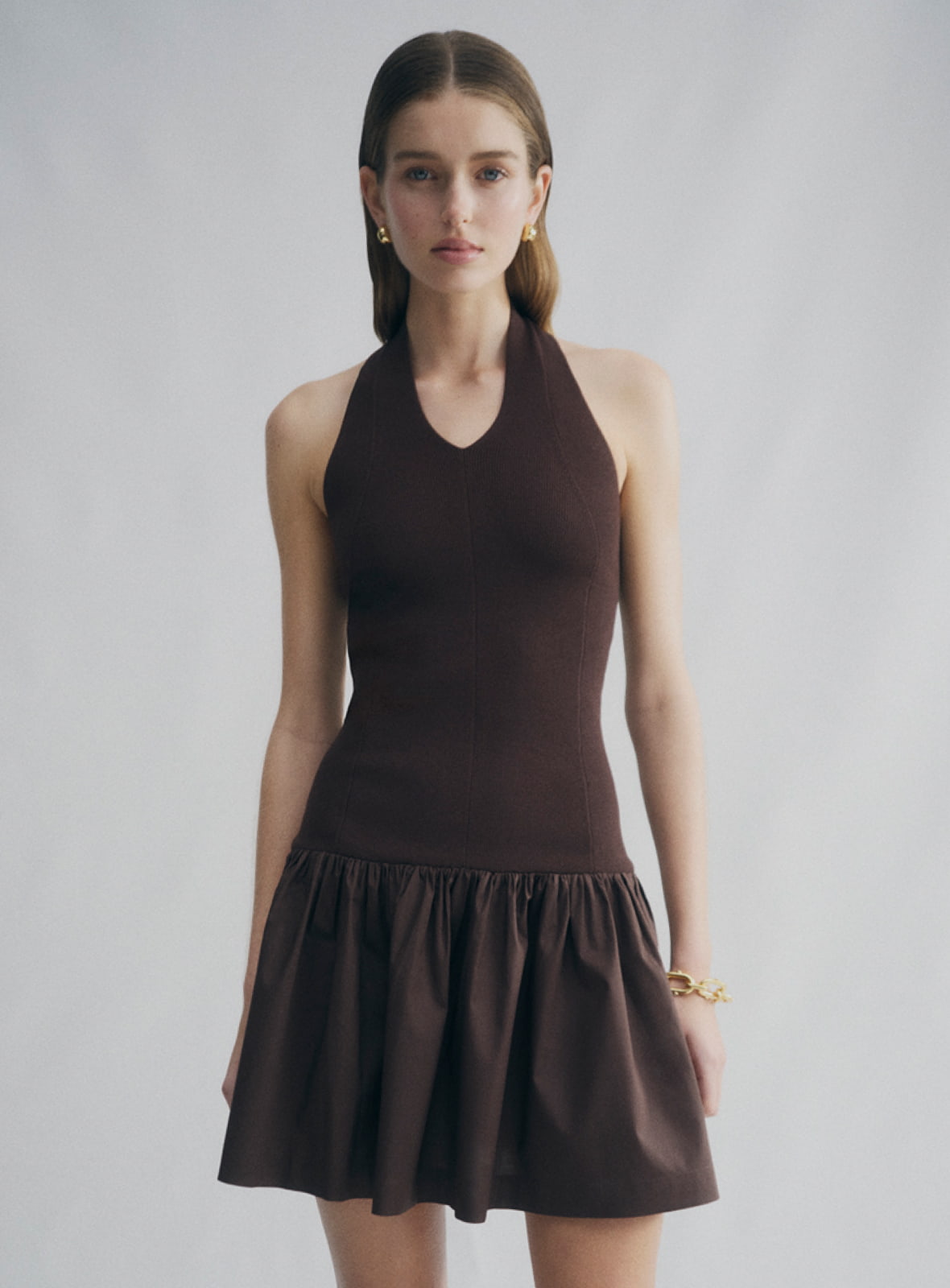 Woman in brown halter mini dress
